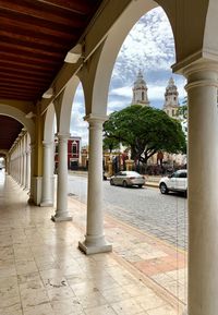 View of historic building seen through colonnade