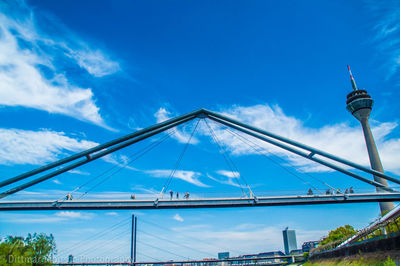 Low angle view of bridge against blue sky