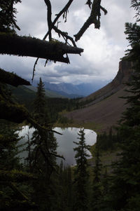 Scenic view of calm sea against cloudy sky