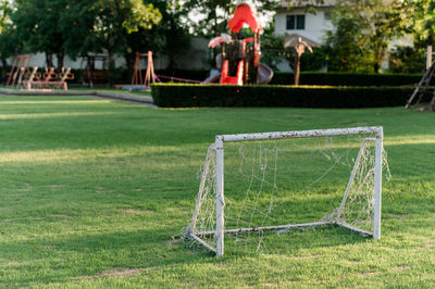 Small soccer field in the park along with soccer balls and small goals for the children 