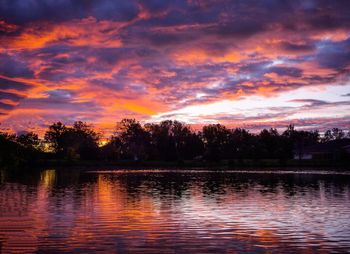 View of lake against cloudy sky during sunset