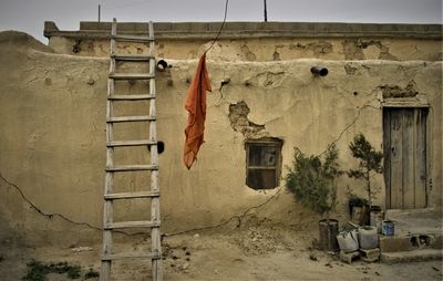 Clothes drying on wall of old building