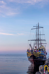 Sailboat in sea against sky