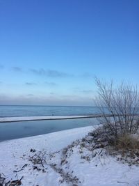 Scenic view of sea against sky during winter