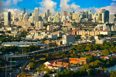 High angle view of modern buildings in city against sky