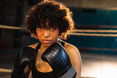 Young woman exercising in gym