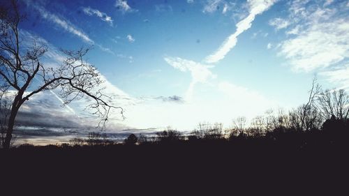 Silhouette landscape against sky