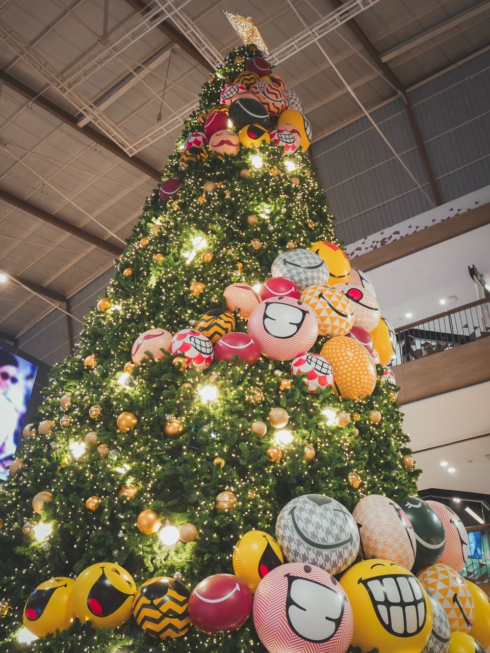 LOW ANGLE VIEW OF ILLUMINATED CHRISTMAS TREE AT NIGHT