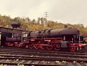 Train on railroad tracks against sky