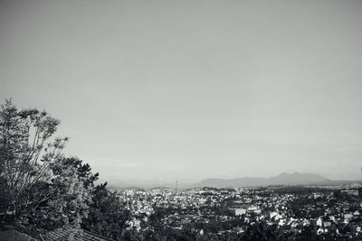 Aerial view of townscape against sky