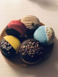 Close-up of multi colored candies on table