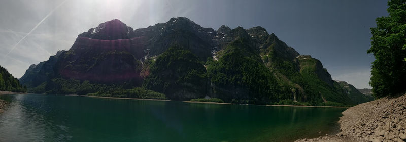 Panoramic view of lake and mountains against sky