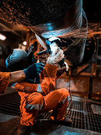 High angle view of man working at workshop