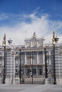 Low angle view of building against cloudy sky