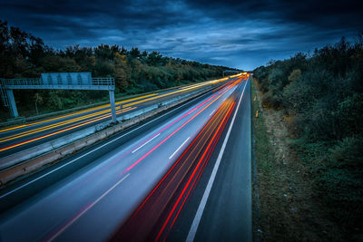 High angle view of light trails on road at night