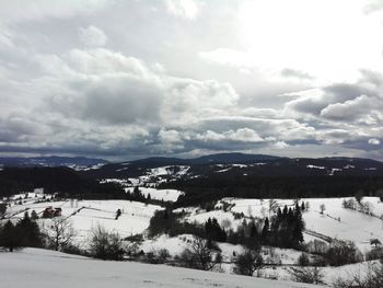 Scenic view of mountains against sky during winter