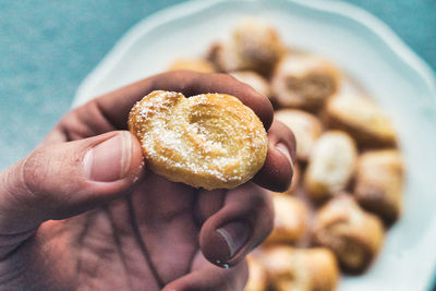 Close-up of hand holding dessert