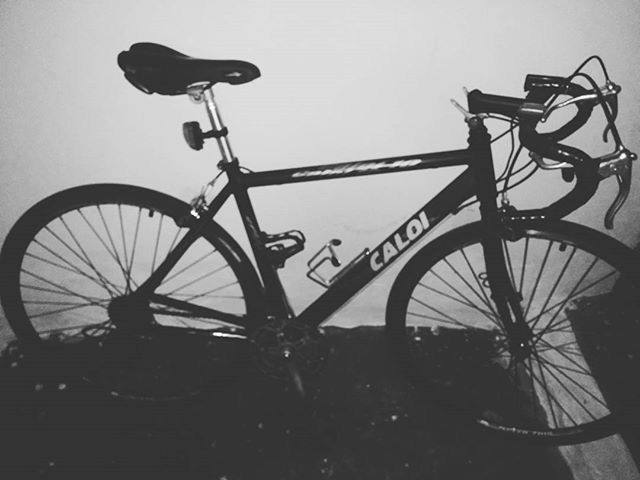 bicycle, built structure, land vehicle, wheel, stationary, transportation, architecture, mode of transport, parked, parking, no people, low angle view, day, outdoors, sky, metal, wall - building feature, railing, clear sky, silhouette