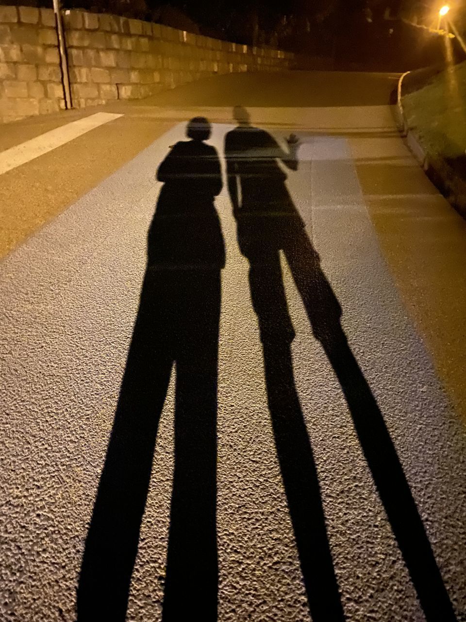 SHADOW OF PEOPLE ON STREET