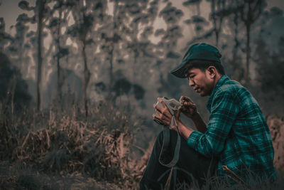 Young man looking away outdoors