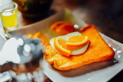 High angle view of orange slice in plate