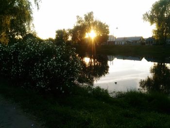 Scenic view of river against sky during sunset