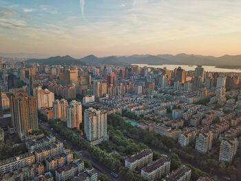 Aerial view of modern buildings in city against sky