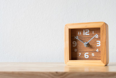 Close-up of box on table against wall at home