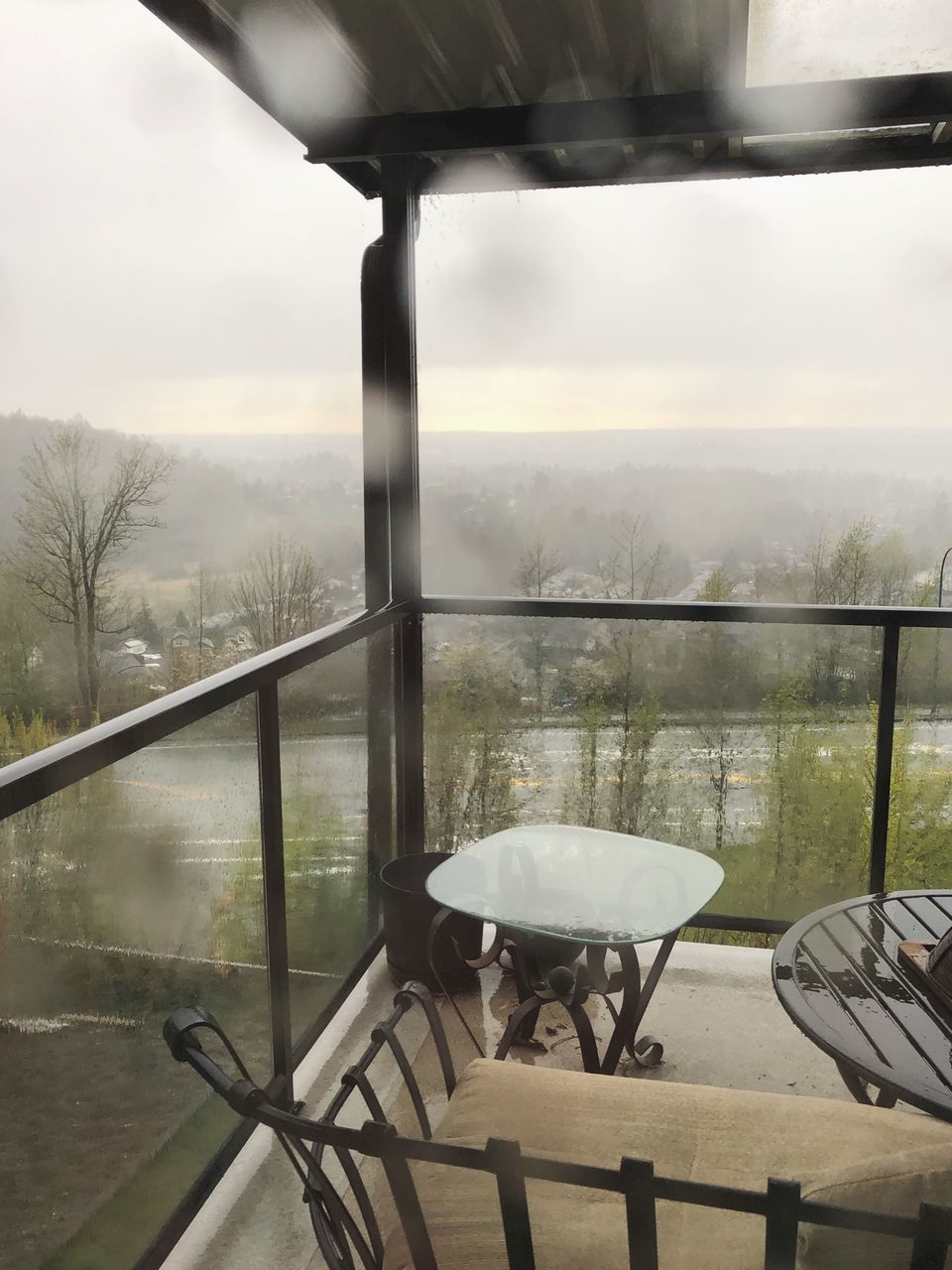 TABLE AND CHAIRS BY WINDOW IN RESTAURANT