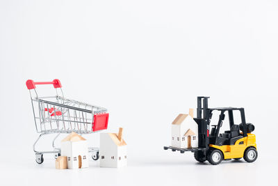 Toy car against white background