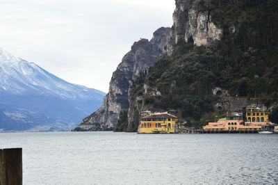 Scenic view of sea and mountain against sky