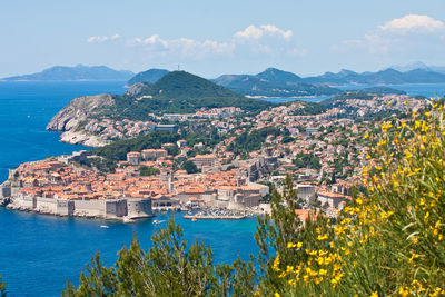 Townscape by sea against sky