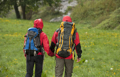 Couple hiking in the rain in england