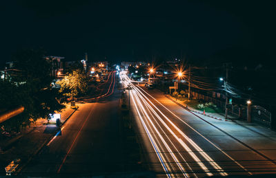 High angle view of light trails on city street at night