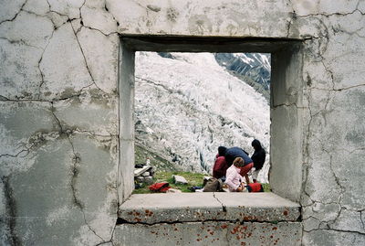 Abandoned hotel in the mountain, view on cold glacier