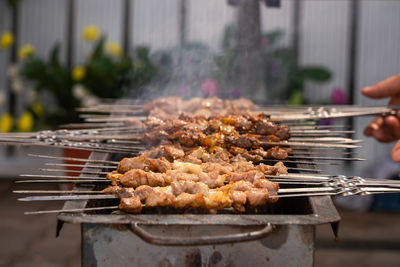 Close-up of meat on barbecue grill