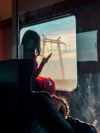 Woman sitting in train