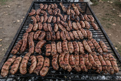 High angle view of meat on barbecue grill
