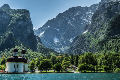 Scenic view of lake and mountains against sky