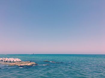 Scenic view of sea against blue sky