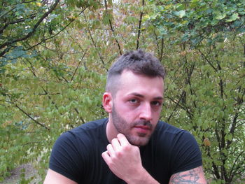 Portrait of young man in forest