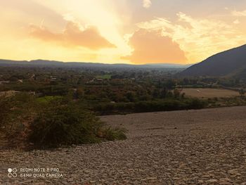 Scenic view of landscape against sky during sunset