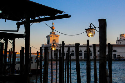 View of city at waterfront during sunset