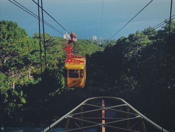 Overhead cable car against sky