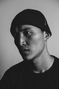 Portrait of young man against white background