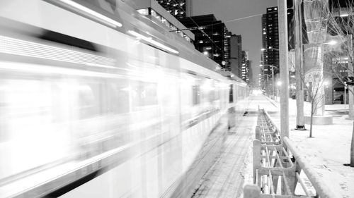 Blurred motion of train in city during winter