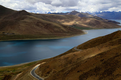 Calm lake along rocky landscape