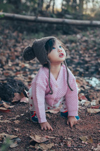 Cute girl lying down on land