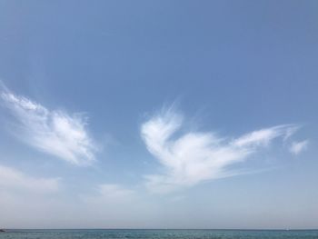 Scenic view of sea against blue sky
