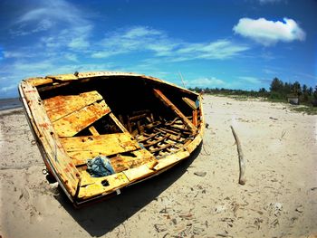 Abandoned boat in river